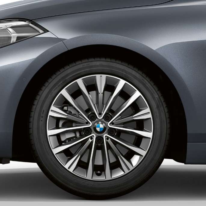17" light-alloy wheel Multispoke 547 style. BMW 1 Series Model Luxury Line in Storm Bay metallic, side view of front with 17'' light-alloy wheel Multispoke 547 style.