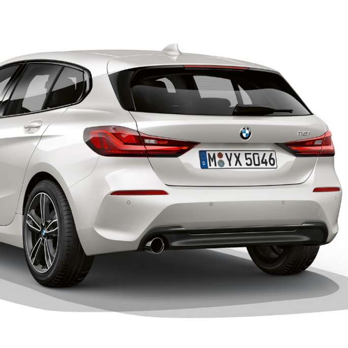 BMW 1 Series Model Sport Line, three-quarter rear. BMW 1 Series Model Sport Line in Mineral White metallic, studio shot three-quarter rear.