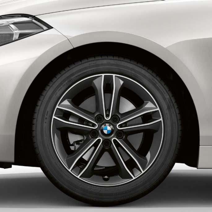 17" light-alloy wheel Double-spoke 549 style. BMW 1 Series Model Sport Line in Mineral White metallic, side view of front with 17'' light-alloy wheel Double-spoke 549 style.