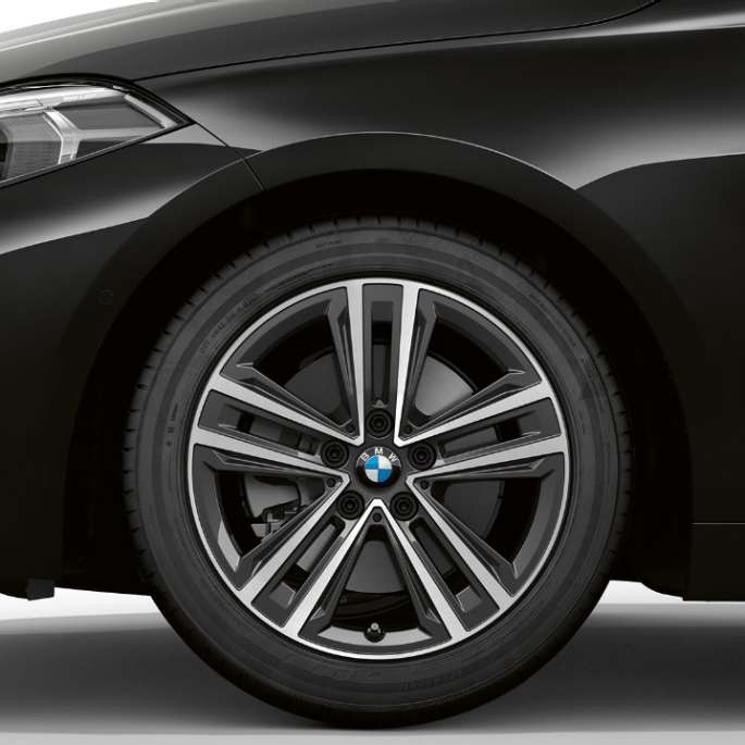 16" light-alloy wheel Star-spoke 517 style. BMW 1 Series Model Advantage in Black, side view of front with 16" light-alloy wheel Star-spoke 517 style.