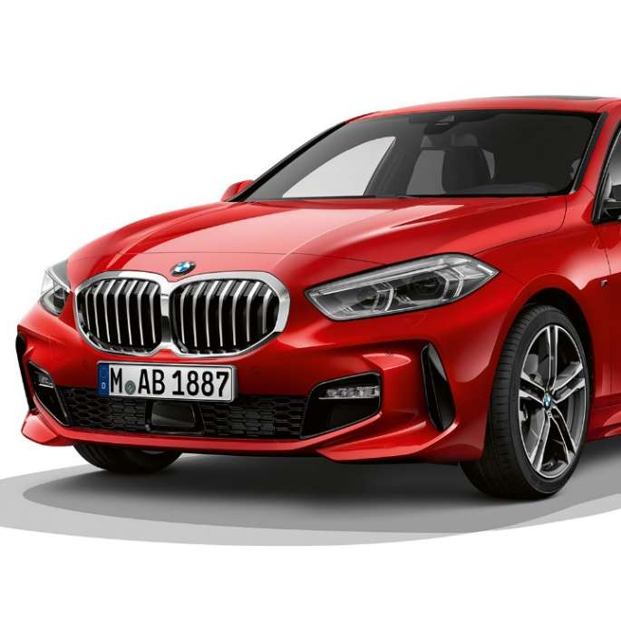 BMW 1 Series Model M Sport, three-quarter front. BMW 1 Series Model M Sport in Melbourne Red metallic, studio shot three-quarter front.