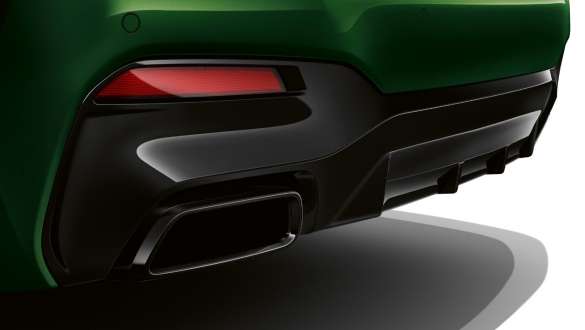 BMW M550i xDrive Sedan with BMW Laserlight G30 LCI Facelift 2020 close-up rear BMW M550i xDrive Sedan with trapezoid tailpipe G30 LCI Facelift 2020 BMW Individual Verde Ermes metallic close-up rear