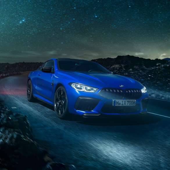 BMW M8 Competition Coupé. The first-ever BMW M8 Competition Coupé in Marina Bay Blue metallic, three-quarter front view.