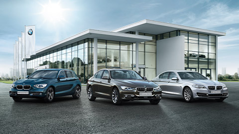 BMW vehicles standing in front of BMW dealer BMW 2 Series BMW vehicles standing in front of BMW dealer