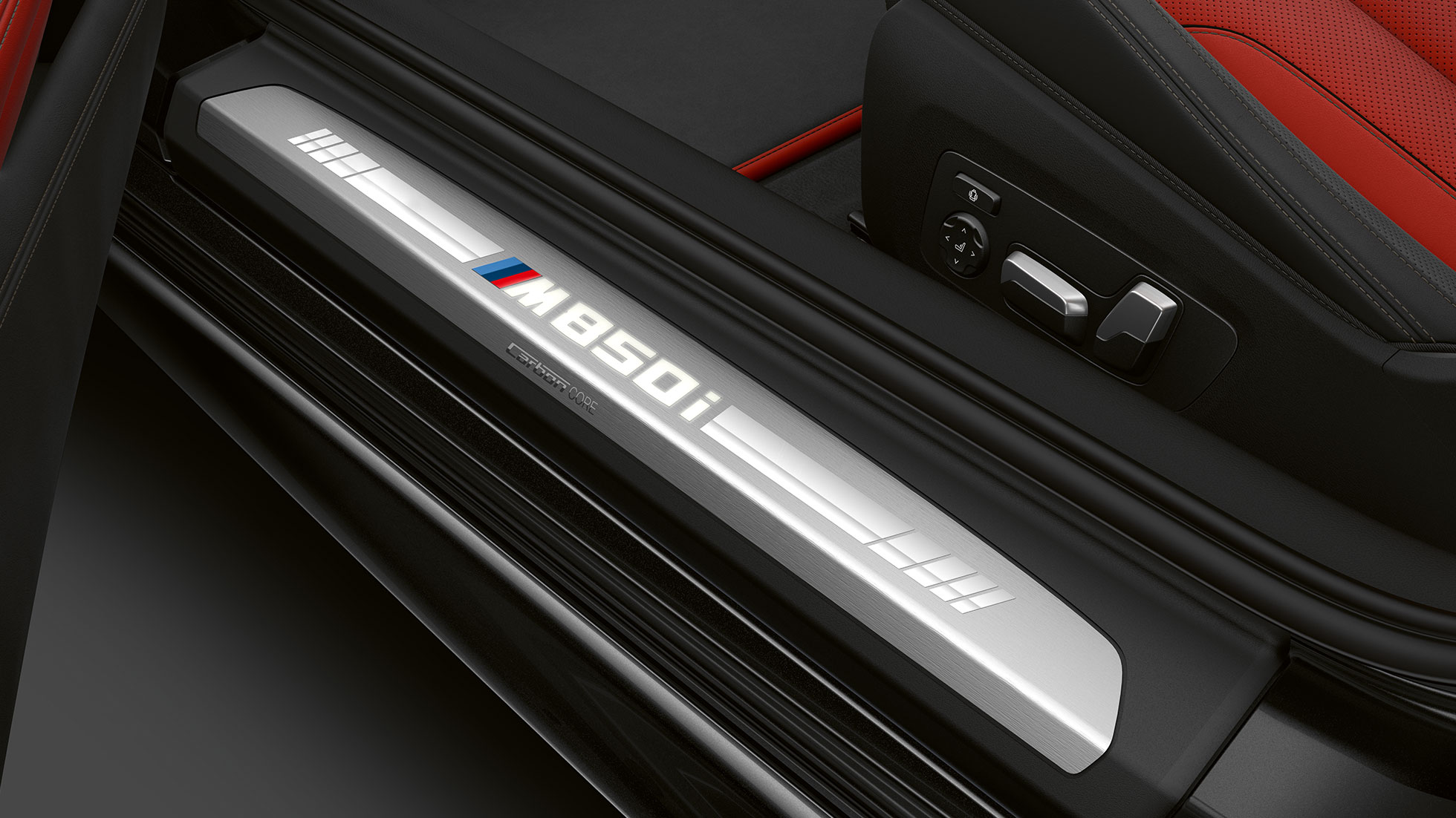 BMW M850i xDrive, Carbon Black metallic, entry door sill. BMW M850i xDrive, Carbon Black metallic, entry door sill.
