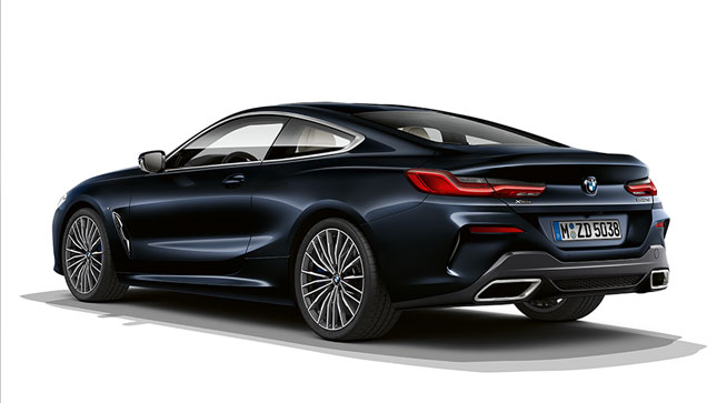 Still shot of the BMW 8 Series Coupé in Carbon Black metallic against a white background.