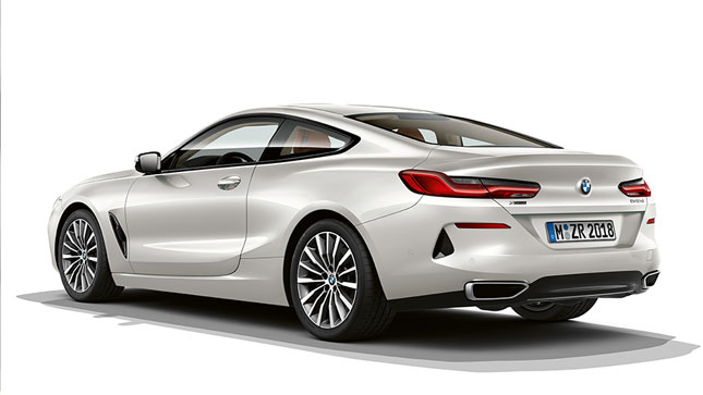 Still shot of the BMW 8 Series Coupé in Mineral White metallic against a white background.