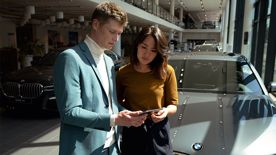 BMW employee advises a customer BMW employee advises a customer