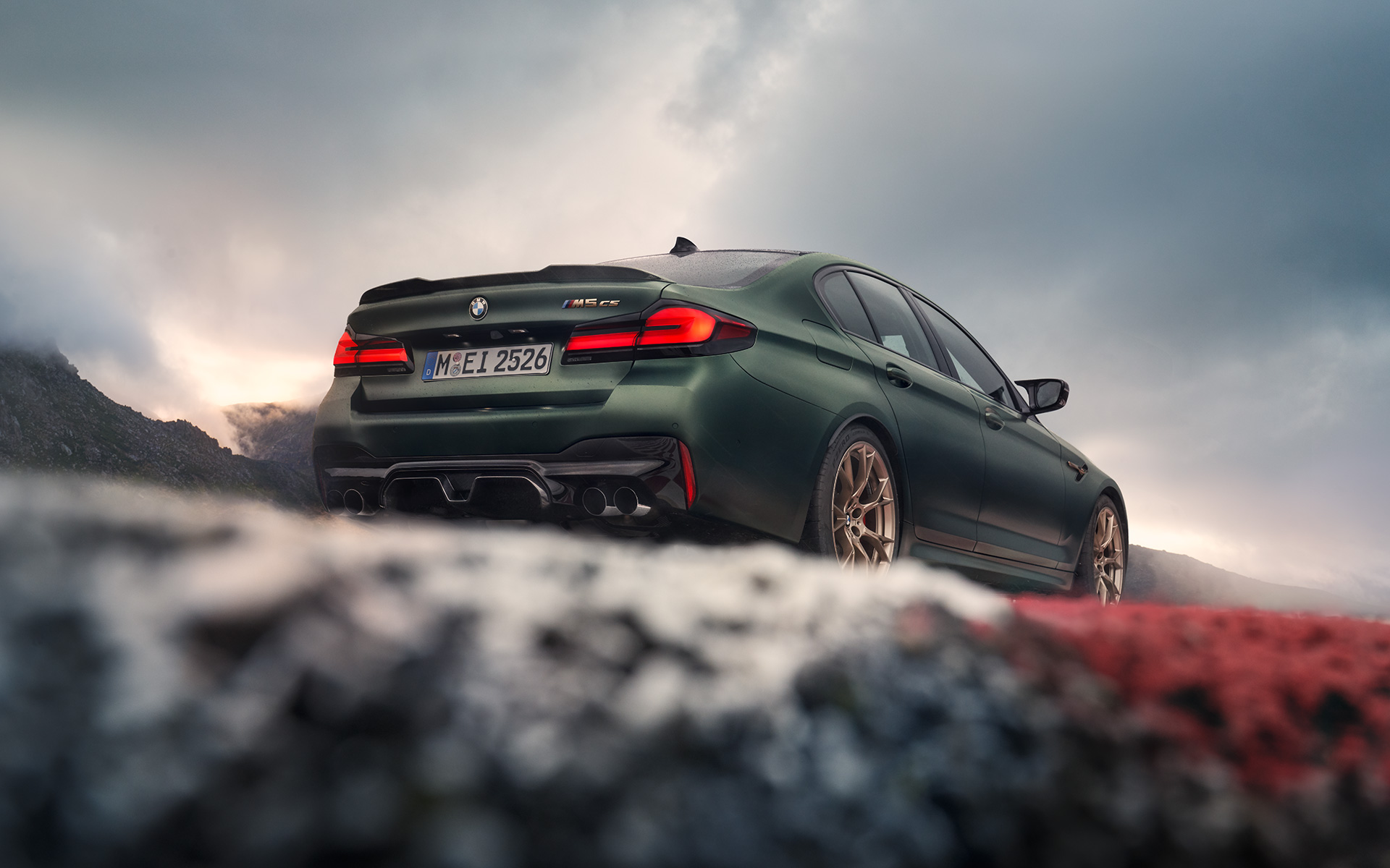 BMW M5 CS F90 2021 Frozen Deep Green metallic rear view low angle shot 
