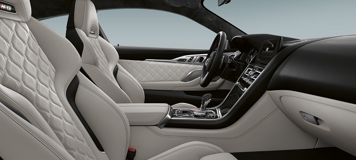 Full fine-grain leather 'Merino' | Silverstone and BMW Individual interior trim Piano Finish Black. BMW Individual M8 Coupé, interior in full fine-grain leather 'Merino' | Silverstone and BMW Individual interior trim Piano Finish Black.