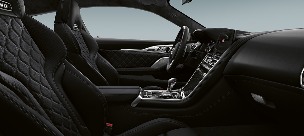 Full fine-grain leather 'Merino' | Black and BMW Individual interior trim Piano Finish Black. BMW M8 Competition Coupé, interior in full fine-grain leather 'Merino' | Black and BMW Individual interior trim Piano Finish Black.