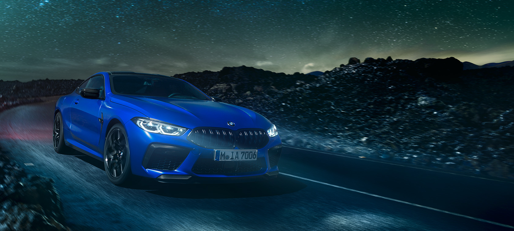 The BMW M8 Competition Coupé. The first-ever BMW M8 Competition Coupé in Marina Bay Blue metallic, three-quarter front view.