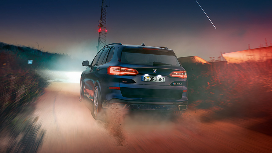 BMW X5 M50d with M roof spoiler G05 2018 SUV Carbon black metallic rear view