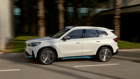 BMW X Series BMW iX1 U11 side view driving on the road